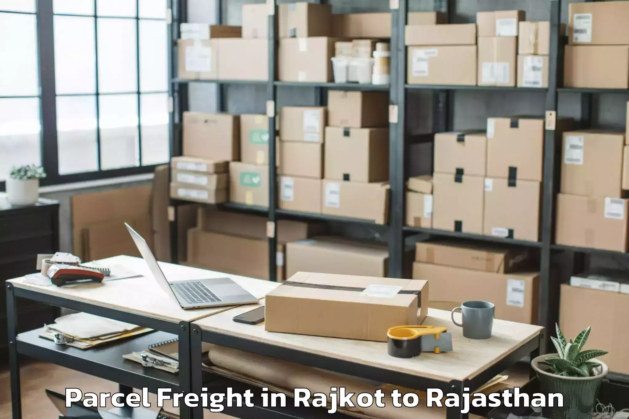 Easy Rajkot to Fatehpur Sikar Parcel Freight Booking